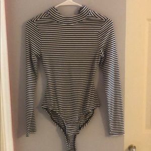 black and white striped high-neck bodysuit